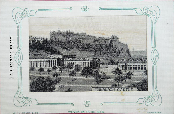 Bookmark woven in black and white silk, of Edinburgh Castle on hill above scene of Edinburgh