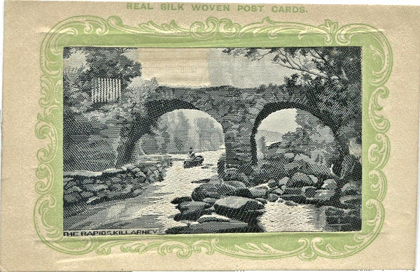 Black and white silk with man navigating rapids in a canoe