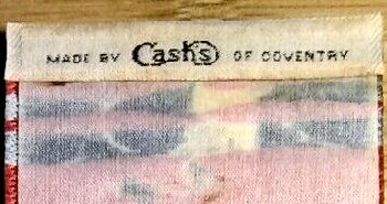 woven J & J Cash name on reverse top turnover of this bookmark