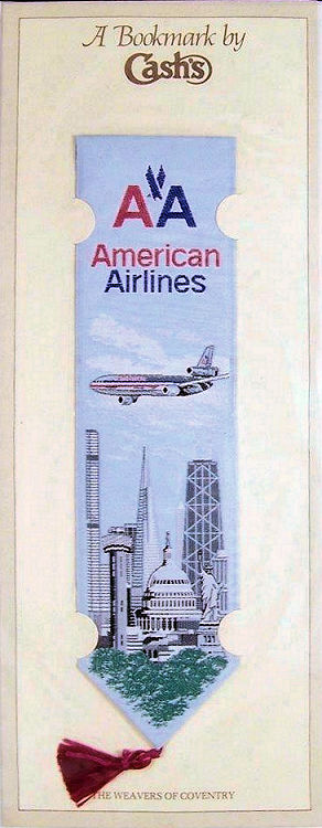 J & J Cash woven bookmark, with woven title and picture of a plane flying over a city scape