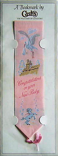 J & J Cash woven bookmark, with title words and image of a stork and a lamb