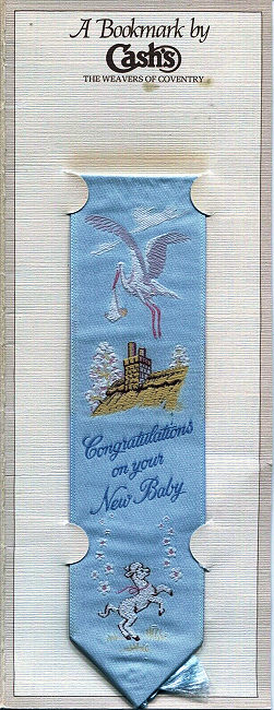 J & J Cash woven bookmark, with title words and image of a stork and a lamb