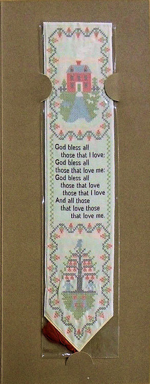 J & J Cash woven bookmark, with image of an embroidered house, words of verse and image of embroidered Christmas tree with nine red dots each side of house