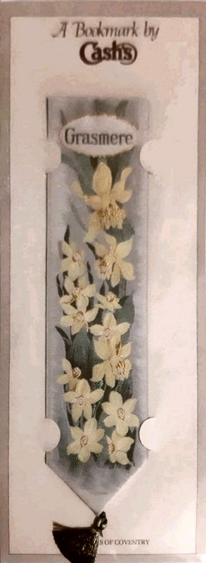 J & J Cash woven bookmark, with single title word and images of yellow daffodils