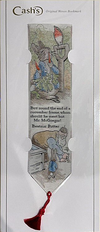 Cash's woven bookmark of Peter Rabbit, and words: But round the end of a cucumber frame