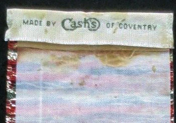 woven name of Cash's on the reverse top turnover of this bookmark