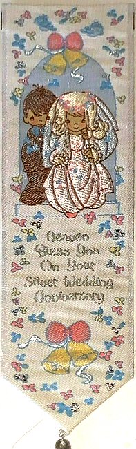 Cash's woven bookmark, with title words and image of a bride and groom
