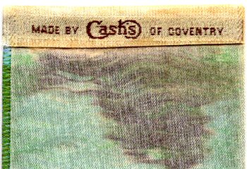 woven name of Cash's on the reverse top turnover of this bookmark