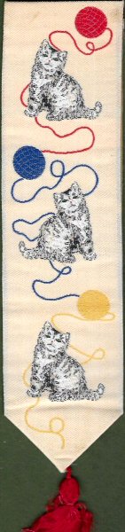 J & J Cash woven bookmark, with no words, but images of three kittens