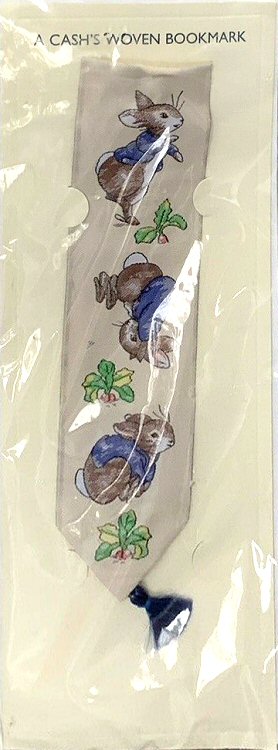 Cash's woven bookmark with no woven words, just imags of three rabbits jumping and tumbling