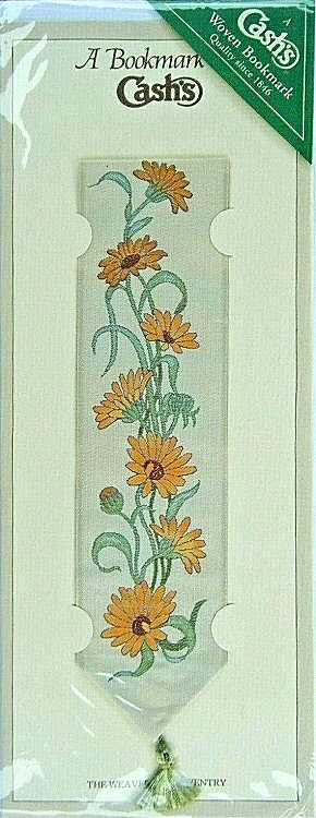 J & J Cash woven bookmark, with no words, but images of various Gerbera flowers