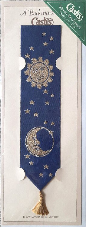 J & J Cash woven bookmark, with no words, but images of the sun, the moon and of multiple stars