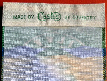 woven J & J Cash name on the reverse top turn-over of this bookmark