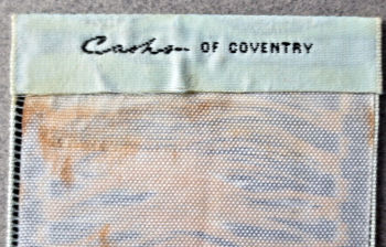 J & J Cash name woven on the reverse top turn-over of this bookmark