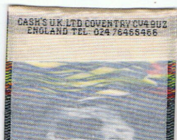 J & J Cash woven logo on the reverse top turnover of this bookmark