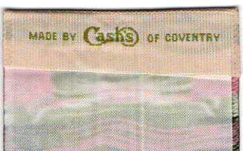 woven J & J Cash name on reverse top turnover of this bookmark