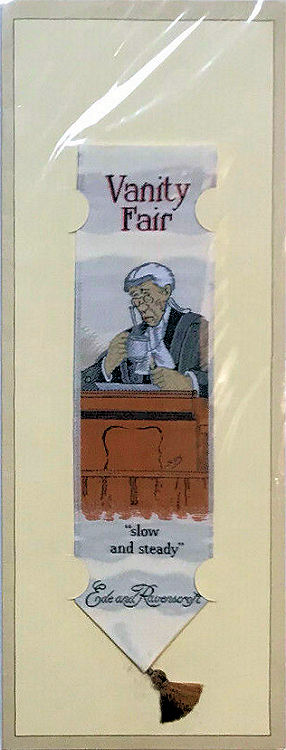 Cash's woven bookmark with VANITY FAIR title, and image of a judge with words below - slow and steady