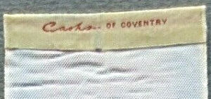 woven name of Cash's on the reverse top turnover of the longer bookmark