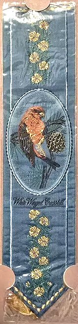 J & J Cash woven bookmark, with picture of a bird, and title words