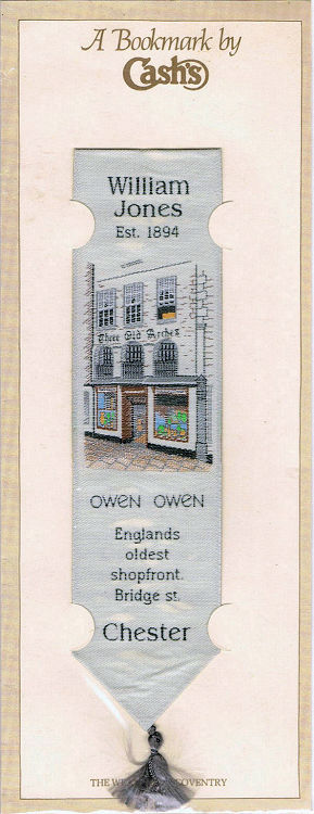 J & J Cash woven bookmark, with title words and image of a shop