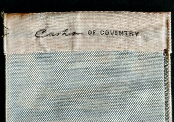 woven J & J Cash name on reverse top turnover of this bookmark