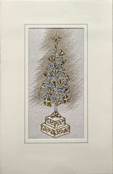 J & J Cash woven Christmas card, with no words, with image of a Christmas Tree mounted on a stand