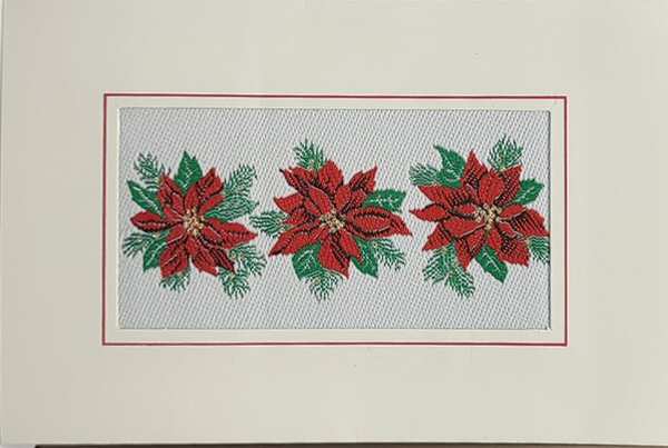 J & J Cash woven Christmas card, with no words, just image of three Poinsettias in a row