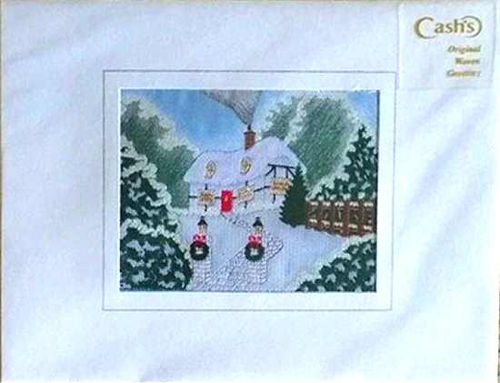 J & J Cash woven Christmas card, with no words, just image of a snow covered house & garden