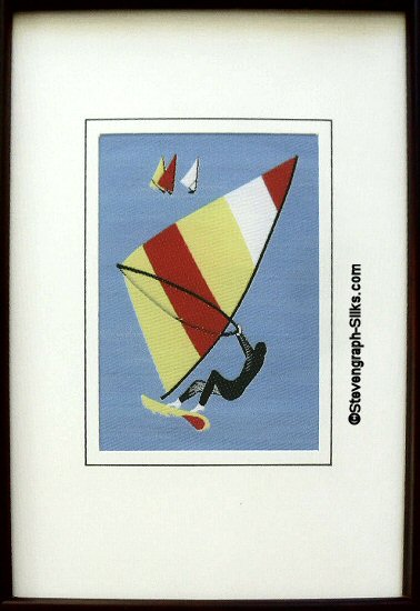 J & J Cash woven sports card, with image of a windsurfer with multicoloured sail
