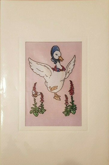 J & J Cash woven card, with no title words, but image of Jemima Puddle-Duck and flowers