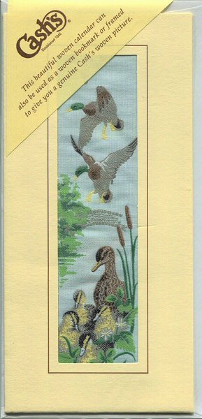 J & J Cash woven bookmark with a 1995 calendar printed on the reverse of the card
