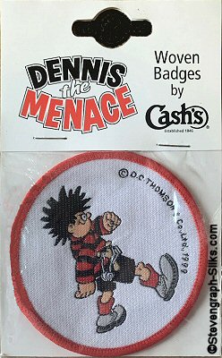 J & J Cash woven saw-on badge featuring Dennis The Menace