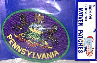 J & J Cash woven saw-on label with words: Pennsylvania