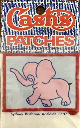 J & J Cash woven saw-on label no words: image of a pink elephant
