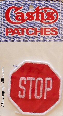 J & J Cash woven saw-on label with single word: STOP
