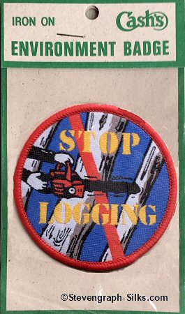J & J Cash woven saw-on label with title words and image of a chain saw cutting a tree