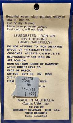 J & J Cash woven saw-on label reverse