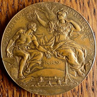 front view of 1889 Exposition Universelle medal awarded to J & J Cash
