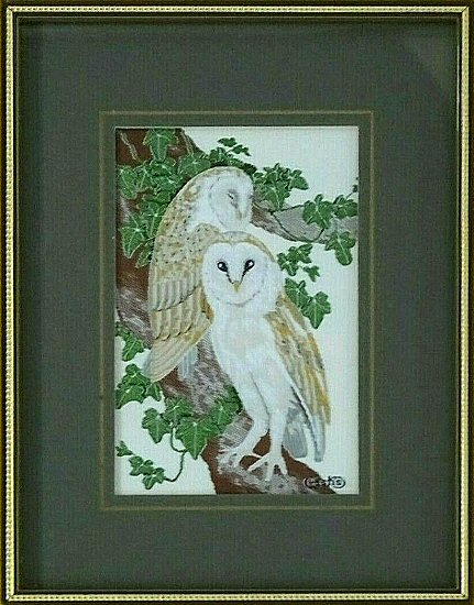 J & J Cash woven picture of a bird, with no words, but image of two Barn Owls