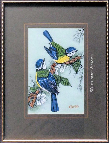 J & J Cash woven picture of a bird, with no words, but image of Blue Tits with white flowers