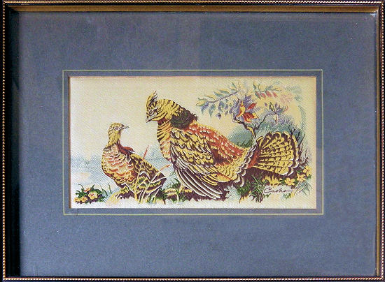 J & J Cash woven picture of a bird, with no words, but image of a pair of Grouse