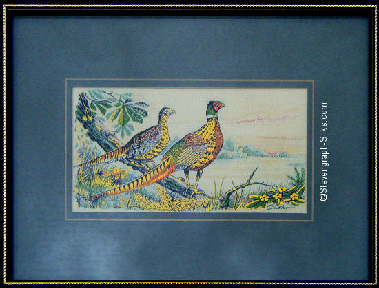 J & J Cash woven picture of a bird, with no words, but image of two Pheasants
