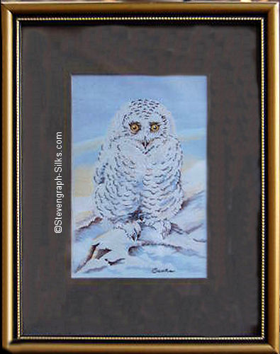 J & J Cash woven picture of a bird, with no words, but image of a Snowy Owl chick