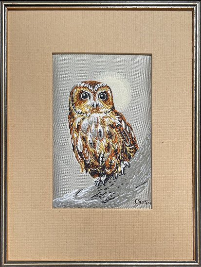 J & J Cash woven picture of a bird, with no words, but image of a Tawny Owl