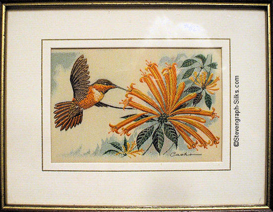 J & J Cash woven picture of a bird, with no words, but image of a Rufous Humming Bird