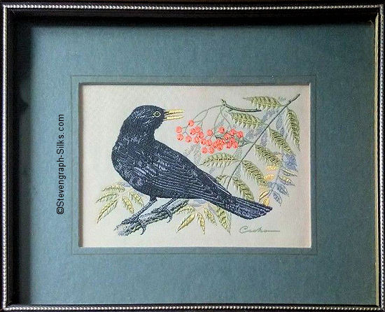 J & J Cash woven picture of a bird, with no words, but image of a Blackbird
