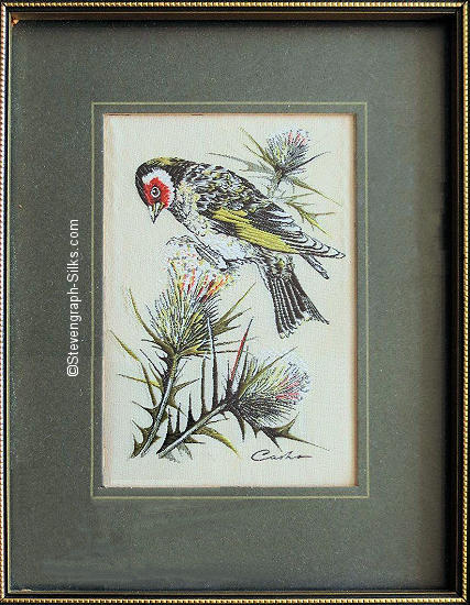 J & J Cash woven picture of a bird, with no words, but image of a Goldfinch