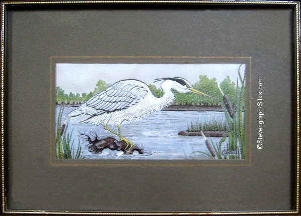 J & J Cash woven picture of a bird, with no words, but image of a Grey Heron