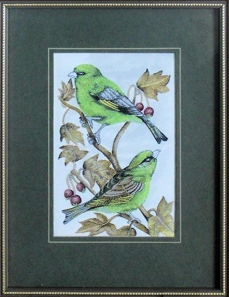 J & J Cash woven picture of a bird, with no words, but image of two Greenfinch