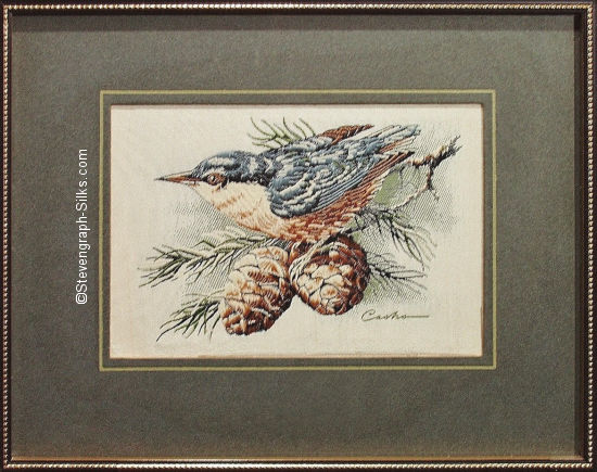 J & J Cash woven picture of a bird, with no words, but image of a Nuthatch, with pine cones